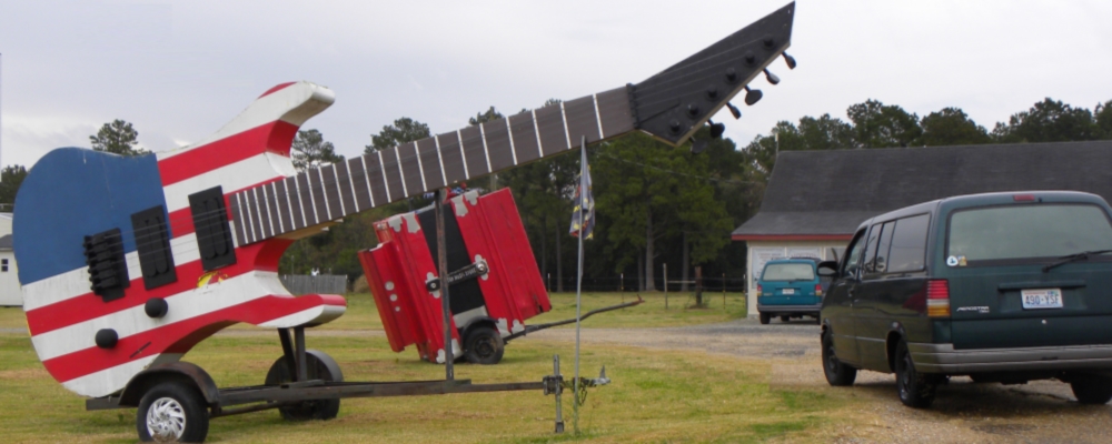 A Guitar and Accordionwith Aerostar parked nearby