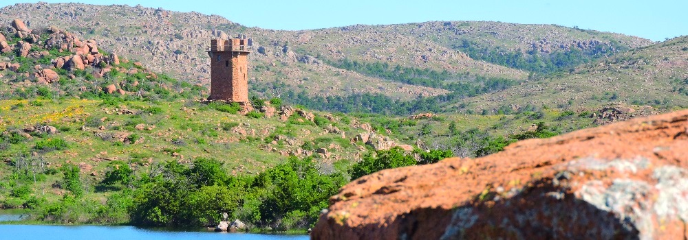 A Tower overlooking a Lake inWichita Mountains Wildlife Refuge